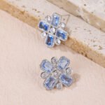 Wholesale blue zircon cross earrings with rectangular and round cubic zirconia stones, platinum plated on a copper base with a 925 silver needle, from JuneJewelry.com.