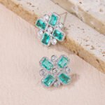 Wholesale blue zircon cross earrings with rectangular and round cubic zirconia stones, platinum plated on a copper base with a 925 silver needle, from JuneJewelry.com.