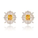 Wholesale pink gemstone earrings with a gold plated setting and zircon halo on 925 sterling silver pins from JuneJewelry.com – unique fashion jewelry for bulk orders.