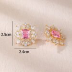 Wholesale pink gemstone earrings with a gold plated setting and zircon halo on 925 sterling silver pins from JuneJewelry.com – unique fashion jewelry for bulk orders.
