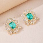 Wholesale pink gemstone earrings with a gold plated setting and zircon halo on 925 sterling silver pins from JuneJewelry.com – unique fashion jewelry for bulk orders.