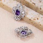 Wholesale ruby red gemstone earrings with a clear zircon cluster on rhodium plated copper and 925 sterling silver pins from JuneJewelry.com – elegant fashion jewelry for bulk orders.