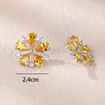 Wholesale ruby red flower earrings with zircon petals on rhodium plated copper and 925 sterling silver pins from JuneJewelry.com – elegant floral jewelry for bulk orders.