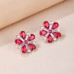 Wholesale ruby red flower earrings with zircon petals on rhodium plated copper and 925 sterling silver pins from JuneJewelry.com – elegant floral jewelry for bulk orders.
