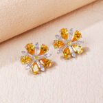 Wholesale ruby red flower earrings with zircon petals on rhodium plated copper and 925 sterling silver pins from JuneJewelry.com – elegant floral jewelry for bulk orders.