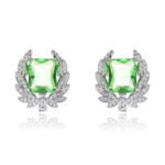 Wholesale zircon leaf earrings with a central red stone and a leaf motif with white cubic zirconia, platinum plated on a copper base with a 925 silver needle, from JuneJewelry.com.