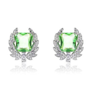 Wholesale zircon leaf earrings with a central red stone and a leaf motif with white cubic zirconia, platinum plated on a copper base with a 925 silver needle, from JuneJewelry.com.