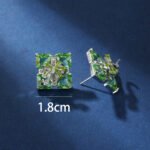 Wholesale green gemstone earrings with a zircon bow on gold plated copper and 925 sterling silver pins from JuneJewelry.com – unique stud earrings for bulk orders.