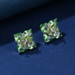 Wholesale green gemstone earrings with a zircon bow on gold plated copper and 925 sterling silver pins from JuneJewelry.com – unique stud earrings for bulk orders.