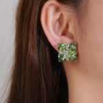 Wholesale green gemstone earrings with a zircon bow on gold plated copper and 925 sterling silver pins from JuneJewelry.com – unique stud earrings for bulk orders.
