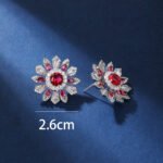 Wholesale Colorful Flower Stud Earrings with a gold plated finish and ruby red cubic zirconia stones from JuneJewelry.com – unique fashion jewelry for bulk orders.