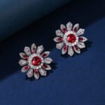 Wholesale Colorful Flower Stud Earrings with a gold plated finish and ruby red cubic zirconia stones from JuneJewelry.com – unique fashion jewelry for bulk orders.