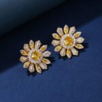 Wholesale Colorful Flower Stud Earrings with a gold plated finish and ruby red cubic zirconia stones from JuneJewelry.com – unique fashion jewelry for bulk orders.