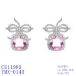Wholesale zircon bow earrings with a cushion-cut pink center stone and cubic zirconia accents, platinum plated with a 925 silver needle, from JuneJewelry.com.