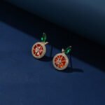 Wholesale lemon slice earrings with bright yellow and green zircon stones, a gold-plated copper base, and a 925 silver needle from JuneJewelry.com.