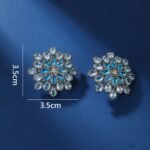 Wholesale Blue Stone Flower Earrings with a gold plated finish and cubic zirconia stones from JuneJewelry.com – unique fashion jewelry for bulk orders.