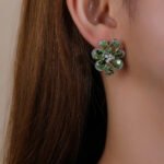 Wholesale Colorful Flower Stud Earrings with a gold plated finish and multi-colored cubic zirconia stones from JuneJewelry.com – unique fashion jewelry for bulk orders.