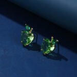 Wholesale Heart Stud Earrings with a gold plated finish and pink and green cubic zirconia stones from JuneJewelry.com – unique fashion jewelry for bulk orders.