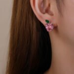 Wholesale Heart Stud Earrings with a gold plated finish and pink and green cubic zirconia stones from JuneJewelry.com – unique fashion jewelry for bulk orders.