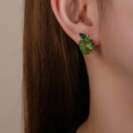 Wholesale Heart Stud Earrings with a gold plated finish and pink and green cubic zirconia stones from JuneJewelry.com – unique fashion jewelry for bulk orders.