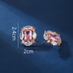 Wholesale pink gemstone earrings with a gold plated setting and zircon cluster on 925 sterling silver pins from JuneJewelry.com – unique fashion jewelry for bulk orders.