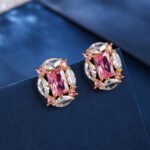 Wholesale pink gemstone earrings with a gold plated setting and zircon cluster on 925 sterling silver pins from JuneJewelry.com – unique fashion jewelry for bulk orders.