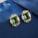 Wholesale pink gemstone earrings with a gold plated setting and zircon cluster on 925 sterling silver pins from JuneJewelry.com – unique fashion jewelry for bulk orders.