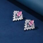 Wholesale Cubic Zirconia Stud Earrings with a central pear-shaped stone and silver plating from JuneJewelry.com – elegant and unique jewelry for bulk orders.