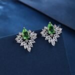 Wholesale Cubic Zirconia Stud Earrings with a central pear-shaped stone and silver plating from JuneJewelry.com – elegant and unique jewelry for bulk orders.