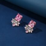 Wholesale pink gemstone earrings with a gold plated setting and zircon cluster on 925 sterling silver pins from JuneJewelry.com – unique fashion jewelry for bulk orders.