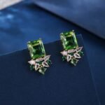 Wholesale pink gemstone earrings with a gold plated setting and zircon cluster on 925 sterling silver pins from JuneJewelry.com – unique fashion jewelry for bulk orders.