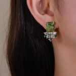 Wholesale pink gemstone earrings with a gold plated setting and zircon cluster on 925 sterling silver pins from JuneJewelry.com – unique fashion jewelry for bulk orders.