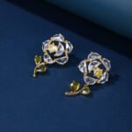 Wholesale Dangle Flower Stud Earrings with a gold plated finish and pink and green cubic zirconia stones from JuneJewelry.com – unique fashion jewelry for bulk orders.