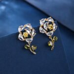 Wholesale Dangle Flower Stud Earrings with a gold plated finish and pink and green cubic zirconia stones from JuneJewelry.com – unique fashion jewelry for bulk orders.