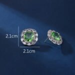 Wholesale pink gemstone stud earrings with a zircon halo on rhodium plated copper and 925 sterling silver pins from JuneJewelry.com – elegant fashion jewelry for bulk orders.