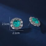 Wholesale pink gemstone stud earrings with a zircon halo on rhodium plated copper and 925 sterling silver pins from JuneJewelry.com – elegant fashion jewelry for bulk orders.