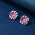 Wholesale pink gemstone stud earrings with a zircon halo on rhodium plated copper and 925 sterling silver pins from JuneJewelry.com – elegant fashion jewelry for bulk orders.