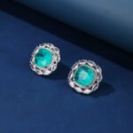 Wholesale pink gemstone stud earrings with a zircon halo on rhodium plated copper and 925 sterling silver pins from JuneJewelry.com – elegant fashion jewelry for bulk orders.