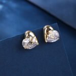 Wholesale heart stud earrings with a clear zircon stone on gold plated copper and 925 sterling silver pins from JuneJewelry.com – romantic fashion jewelry for bulk orders.