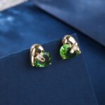 Wholesale heart stud earrings with a clear zircon stone on gold plated copper and 925 sterling silver pins from JuneJewelry.com – romantic fashion jewelry for bulk orders.