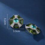 Wholesale pink gemstone stud earrings with a geometric flower design on gold plated copper and 925 sterling silver pins from JuneJewelry.com – unique fashion jewelry for bulk orders.