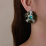 Wholesale pink gemstone stud earrings with a geometric flower design on gold plated copper and 925 sterling silver pins from JuneJewelry.com – unique fashion jewelry for bulk orders.