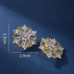 Wholesale Pink Flower Stud Earrings with a gold plated finish and pink and clear cubic zirconia stones from JuneJewelry.com – unique fashion jewelry for bulk orders.