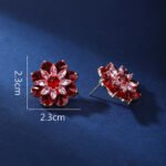 Wholesale Red Flower Stud Earrings with a gold plated finish and ruby red cubic zirconia stones from JuneJewelry.com – unique fashion jewelry for bulk orders.