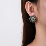 Wholesale Red Flower Stud Earrings with a gold plated finish and ruby red cubic zirconia stones from JuneJewelry.com – unique fashion jewelry for bulk orders.