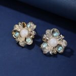 Wholesale Enamel Flower Stud Earrings with a gold plated finish and cubic zirconia stones from JuneJewelry.com – unique fashion jewelry for bulk orders.