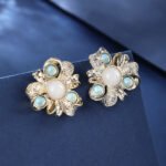 Wholesale Enamel Flower Stud Earrings with a gold plated finish and cubic zirconia stones from JuneJewelry.com – unique fashion jewelry for bulk orders.