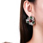 Wholesale Enamel Flower Stud Earrings with a gold plated finish and cubic zirconia stones from JuneJewelry.com – unique fashion jewelry for bulk orders.