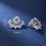 Wholesale Statement Stud Earrings with a gold plated finish and pink and white cubic zirconia stones from JuneJewelry.com – unique fashion jewelry for bulk orders.