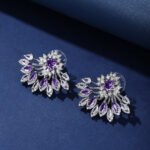 Wholesale Statement Stud Earrings with a gold plated finish and pink and white cubic zirconia stones from JuneJewelry.com – unique fashion jewelry for bulk orders.